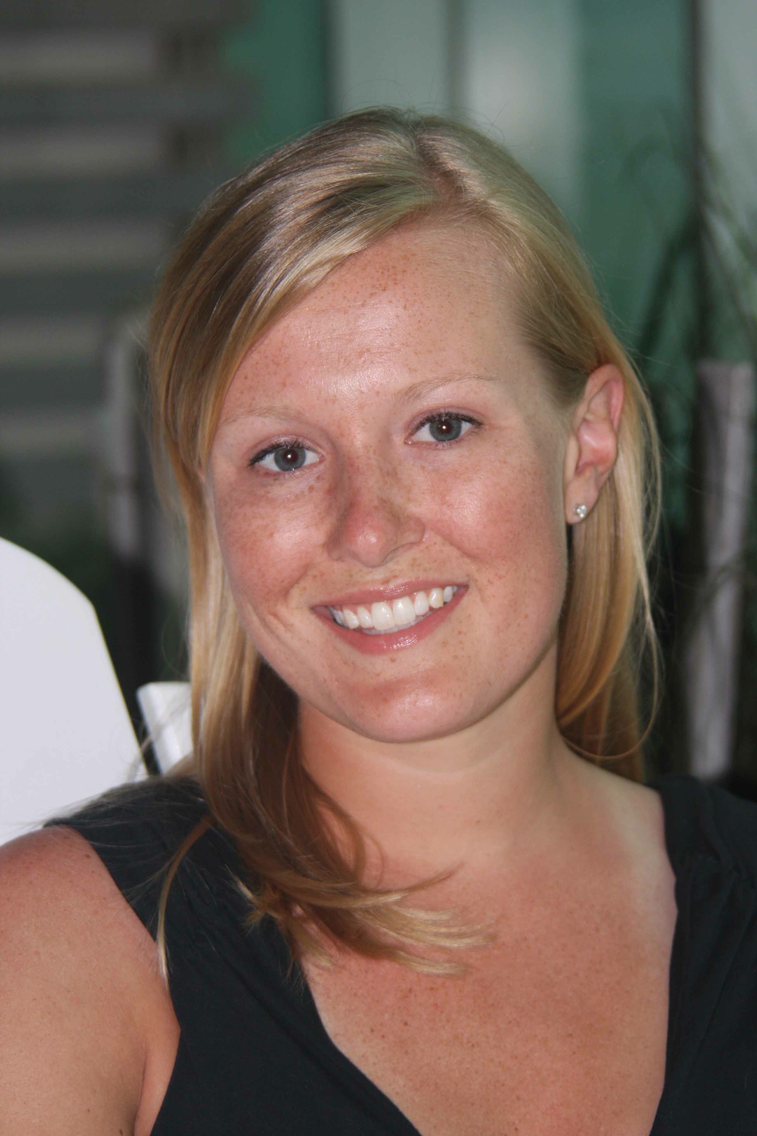 A woman with blonde hair smiling for the camera.