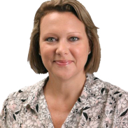 A woman with short hair wearing a floral shirt.