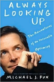 A man is looking up with his hand on his chin.