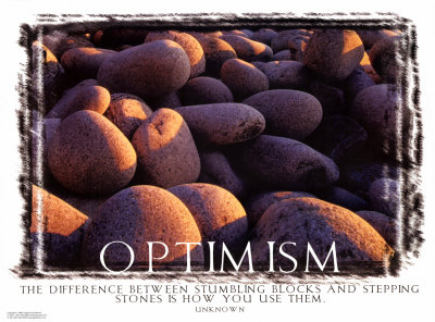 A pile of rocks with the word optimism written on it.