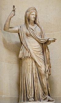 A statue of a woman in a dress