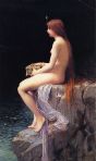 Nude woman sitting on a rocky ledge.