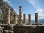 Ancient stone pillars with mountainous backdrop.
