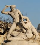 Statue of man fighting a centaur.