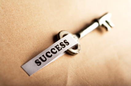 A key with the word success on it.