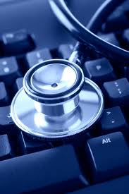 Stethoscope on a computer keyboard, close-up.