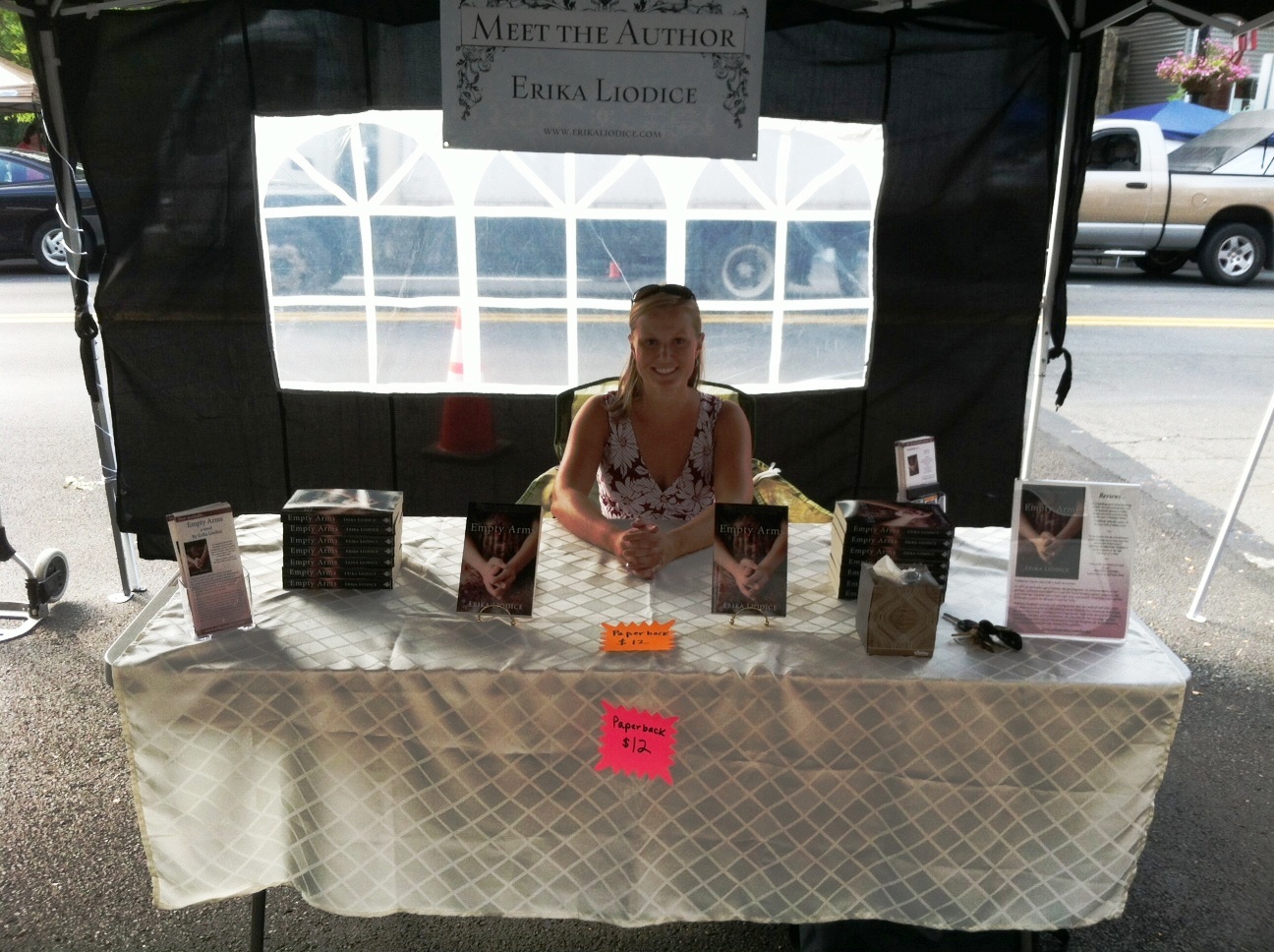 A woman sitting at the table of some kind